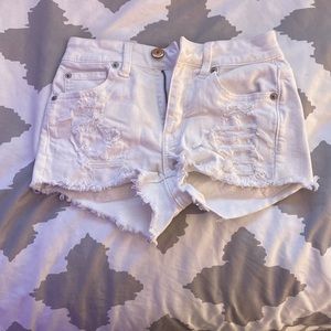 White ripped jean shorts